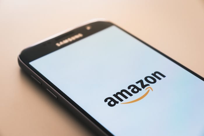 Phone screen showing the Amazon logo.